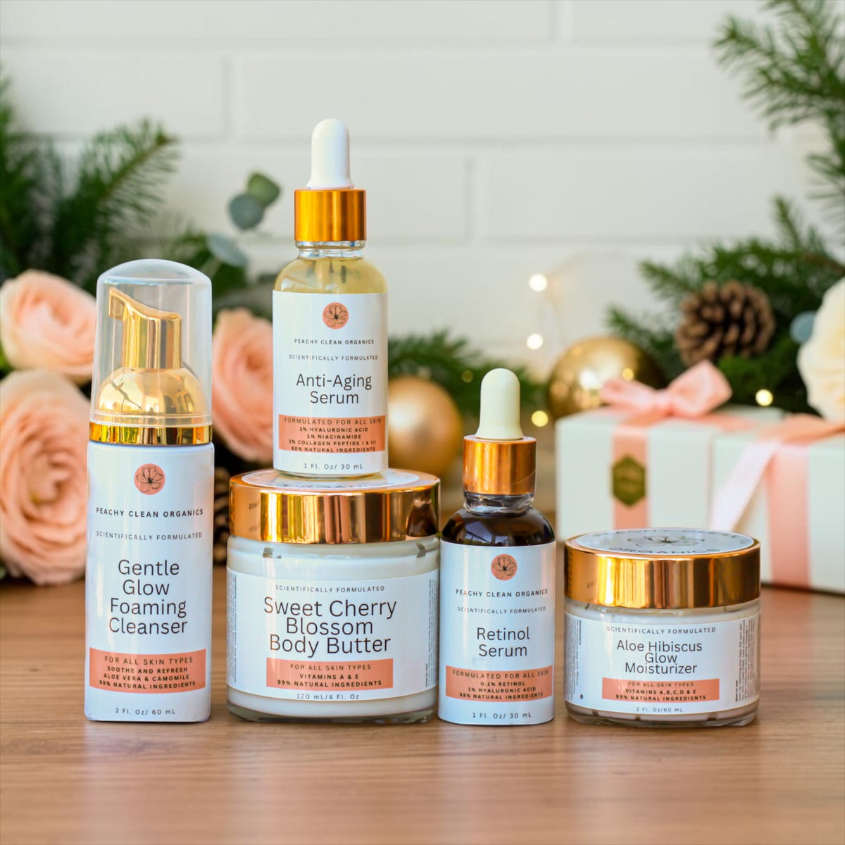 Luxury Christmas skincare gift set with foaming cleanser, anti-aging serum, retinol serum, moisturizer and body butter